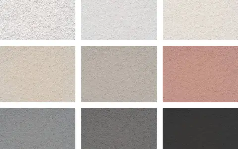 Échantillons de textures de crépi pour une façade maison : blanc, beige, gris, rose.