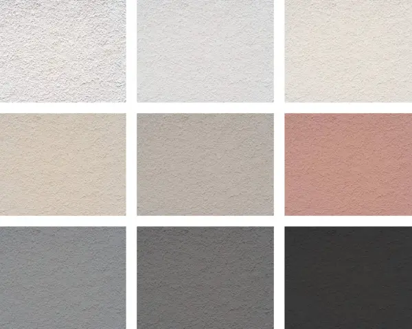 Échantillons de textures de crépi pour une façade maison : blanc, beige, gris, rose.